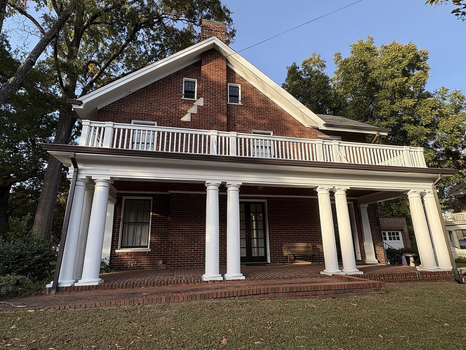 Columned veranda and brick terrace