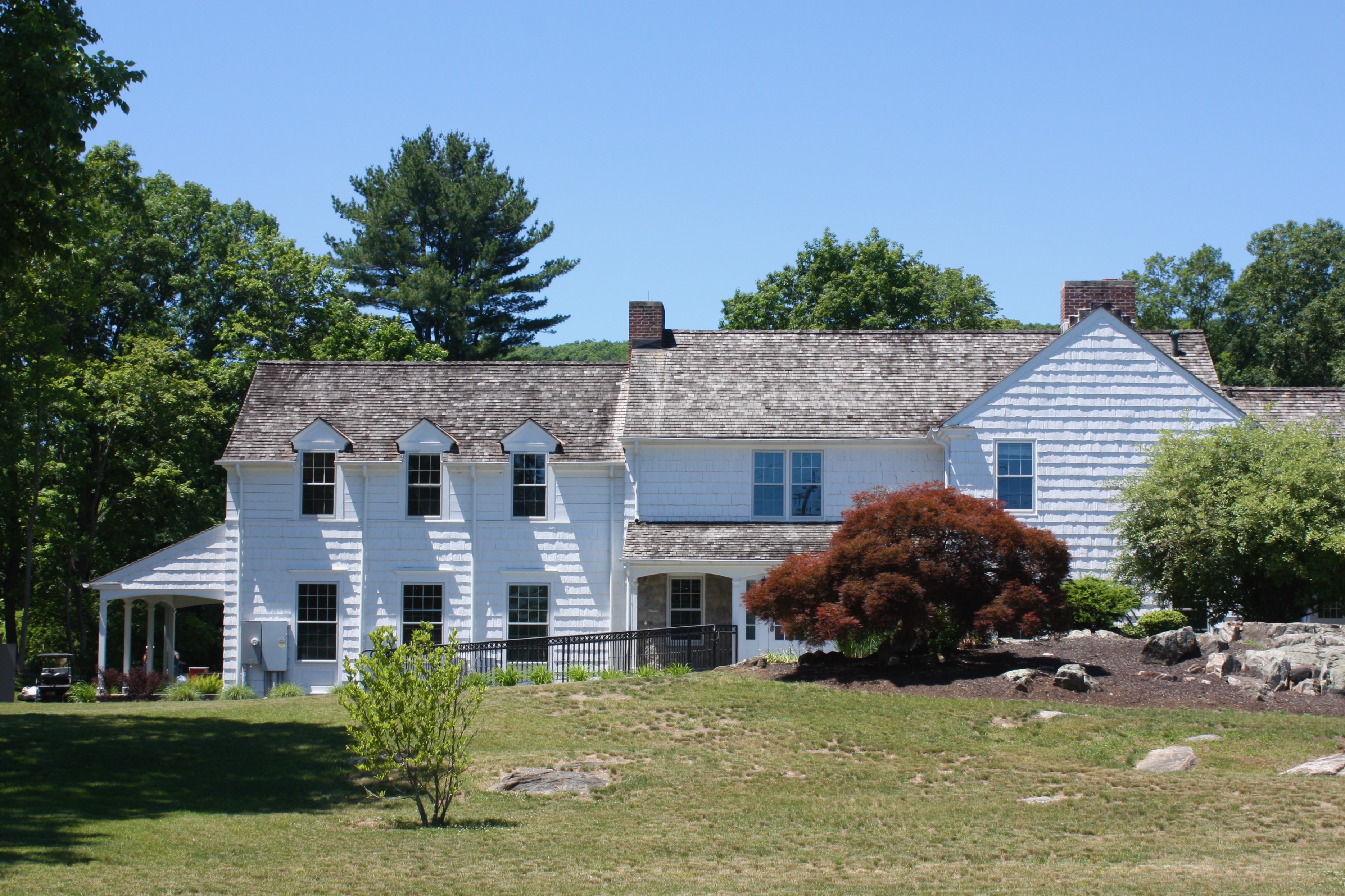 White clapboard house and front lawn